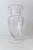 A soft pink footed pedestal vase featuring optic panels and flared top. Attributed to Tiffin Glass, but unconfirmed....