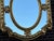 Add refined European elegance to your interior with this striking Louis XVI-style wall mirror, crafted circa 1970. With...