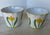 Lovely pair of Italian hand-painted cache pot planters with a colorful and simple daffodil/tulip on each.