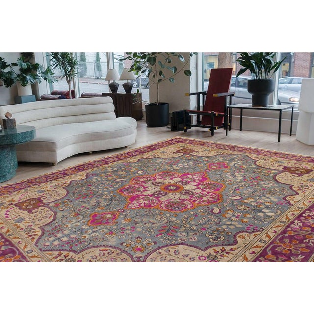 Enhance your living space with this stunning vintage Persian hand-knotted wool rug, a true showstopper that effortlessly...