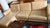 Lind brand (Canada) Beige leather two-piece sectional with left facing chaise with light wood tapered legs, with minimal...