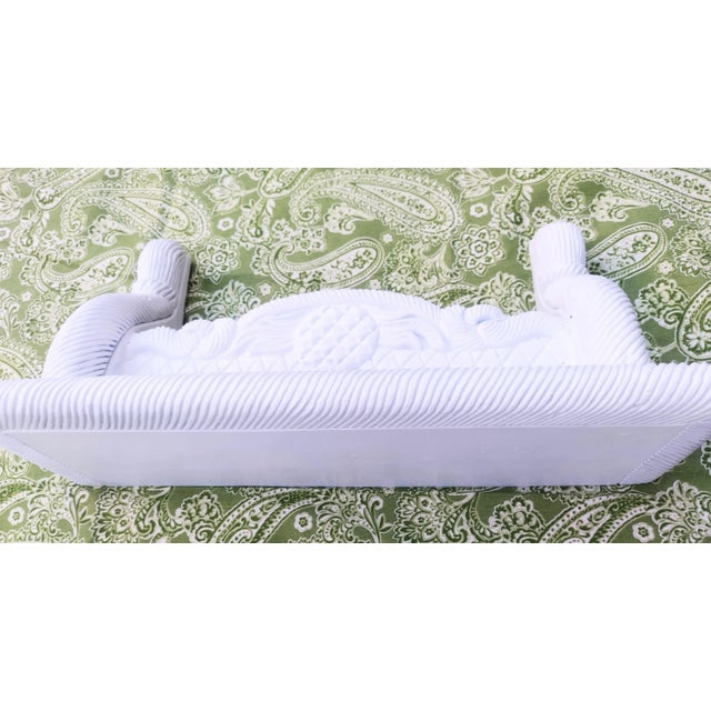 An incredible pair of solid heavy wood vintage Gampel Stoll pineapple carved wall mounted shelves. The shelves are...