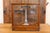 This 20th-century German scale encased in a glass and wood frame is a fine example of precision engineering and functional...