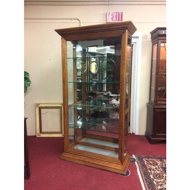 Item: Vintage Oak Case Curio Cabinet (unmarked). Age & Condition: Circa 1990. Good, with small signs of age, like minor...