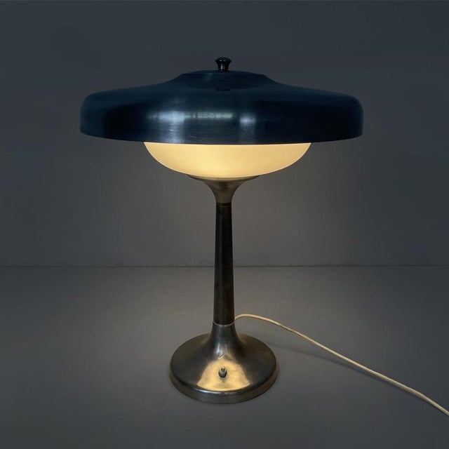 Italian Art Deco table lamp in aluminum and opaline glass, 1940s Metal table lamp. The lamp base is made of burnished...