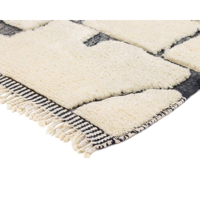 A crisp ivory field mapped with fine charcoal lines that wind and branch like a puzzle or a bird's-eye map — abstract,...