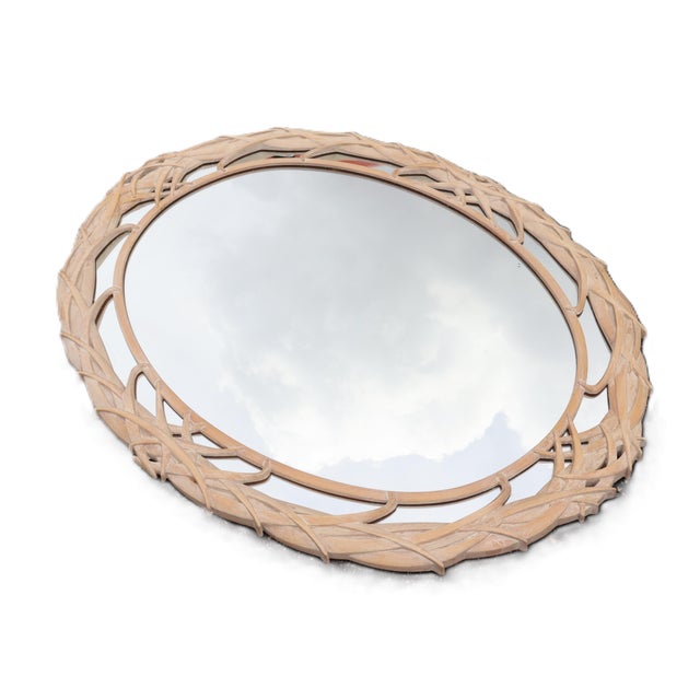 Vintage Carolina Mirror Company oval mirror with palm frond frame.