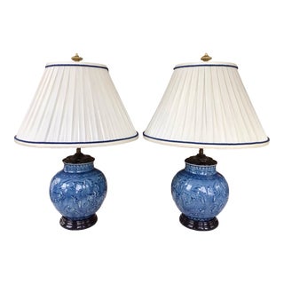 Pair of Vintage Porcelain Blue Lamps With Navy Trimmed White Fabric Shades For Sale