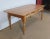 Large farm table from the Rennes region, made of solid cherry wood, with a top composed of 4 large boards forming the...