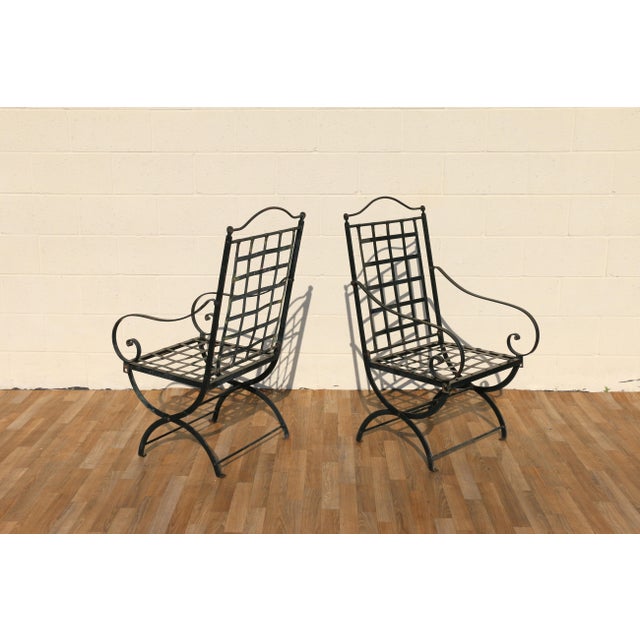 Beautiful vintage pair of wrought iron folding patio armchairs attributed to Hervé Baume, France, 1970s. These sculptural...