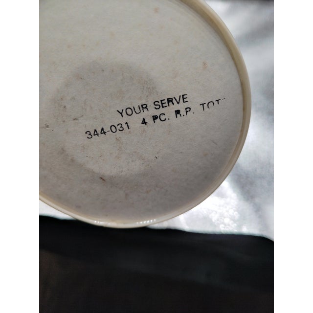 The yellow and blue graphics on all four of the Roly Poly Glasses are in good condition and are engraved outside the...