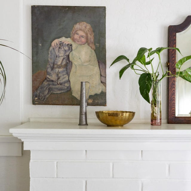 This elegantly understated scalloped brass bowl raised slightly on a round plinth features thick walls and a substantial...