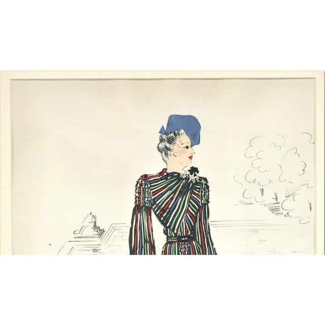 This is a matted large formatted hand-colored fashion illustration with a fabric swatch that dates to the late 1930’s. It...