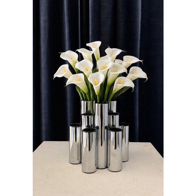 A sculptural group of three vases in a Space Age aesthetic, made in Europe circa 1970. These pieces stand out for their...