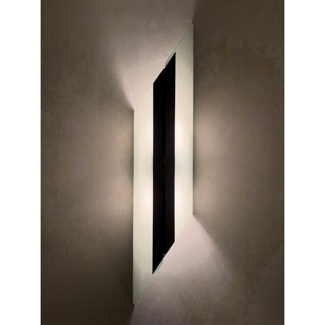 An exceptional collection of 18 matching architectural wall sconces by Donovan Lighting, Ltd., made in the USA and dated...