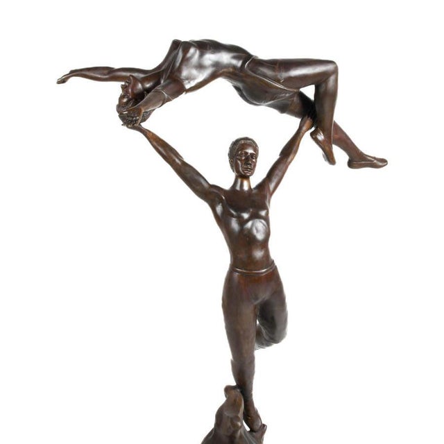 Celebrate motion, balance, and artistic expression with this striking bronze sculpture of a dancing couple, a powerful...