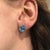 Beautiful Swiss Topaz oval solitaire studs in solid 14k gold. The featured swiss blue topaz sparkles excellently in these...
