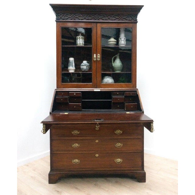 Antique mahogany george iii glazed cabinet bookcase secretaire with an arrangement of pigeon hoes and oak lined drawers...