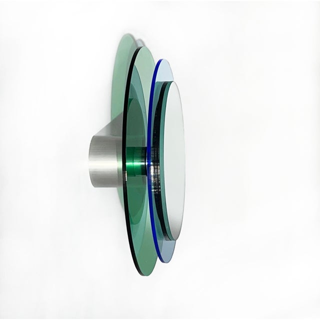 The mirror object float in front of the wall and creates a fascinating sculpture full of positive energy through color,...