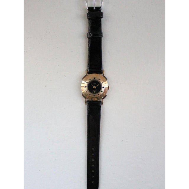 Brand: Eugene Model: Funky Cocktail Case Year: 1960–69 Movement: Manual-winding Case: Gold-plated metal Dial: Black Dial...