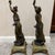 Pair of Signed Emile Carlier Bronze Sculptures A pair of 19th century bronze sculptures on marble bases. Marchand de...