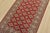 A tribal Bokhara Jaldar rug hand-knotted with fine wool on a cotton foundation. This rug features rows of repeating...
