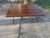 Extra large plank coffee table by Broyhill furniture, made in Indonesia.Bblack with red highlights Iron legs with lion...