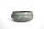 A vintage studio or art pottery small round earthenware bowl, with a ridged top border and a green-grey glaze. Stamped on...