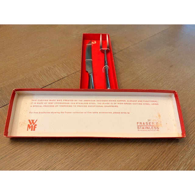 A graded example of mid-century functional art. This authentic WMF Fraser’s two-piece carving set (Model #8852) brings...