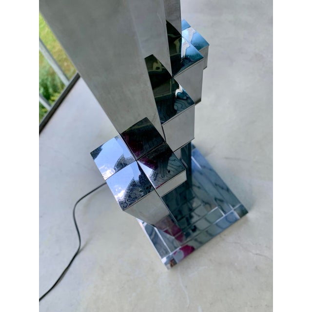 A floor lamp (160cm high) and a matching table lamp (70cm high). Chrome. Original. Rare pair. Top quality. This piece has...