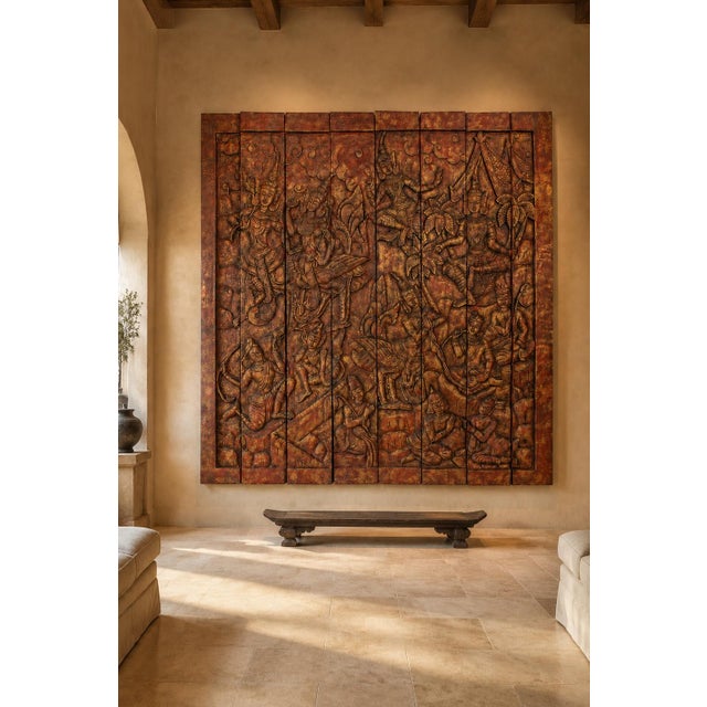 Monumental vintage Thai hand-carved wood wall panel measuring nearly eight feet square. Finished in richly aged red and...