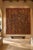 Monumental vintage Thai hand-carved wood wall panel measuring nearly eight feet square. Finished in richly aged red and...