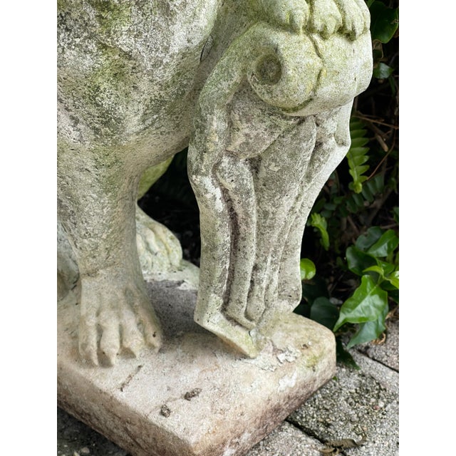 Antique concrete lion sculpture. Garden decor.