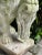 Antique concrete lion sculpture. Garden decor.