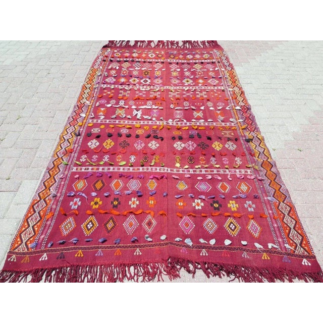 This beautiful, traditional vintage, flatweaved Turkish kilim rug is approximately 60 years old. It is handmade of very...