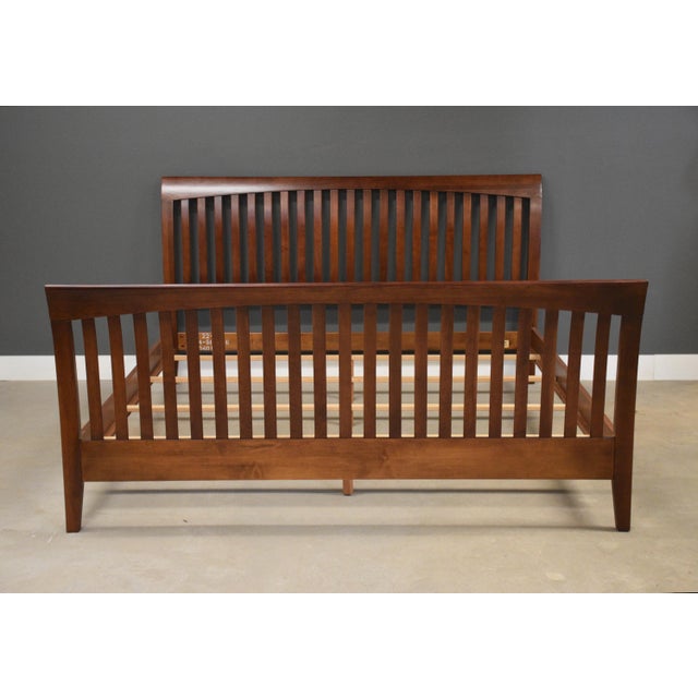 .A solid cherry king size bed by Ethan Allen “American Impressions”. Set includes headboard, footboard, side rails and...