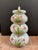This tower of Italian glazed terra-cotta stacking jars features a lovely hand painted floral design on a white glaze...