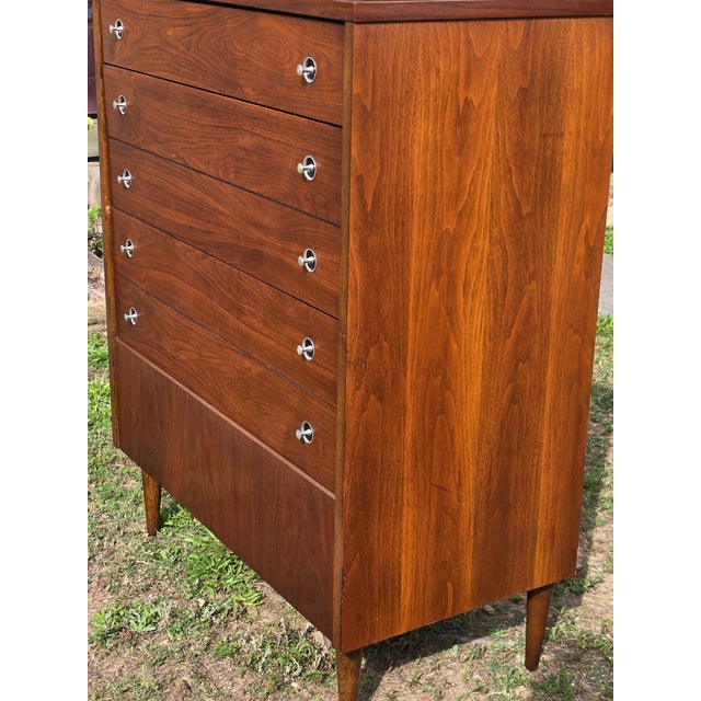 Vintage mid-century Bassett Trimline model walnut highboy dresser with silver pulls. This mid century dresser features...