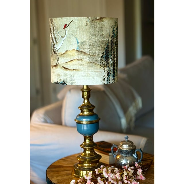 A one-of-a-kind vintage lamp reimagined as a complete design statement. This piece pairs a classic turned brass...