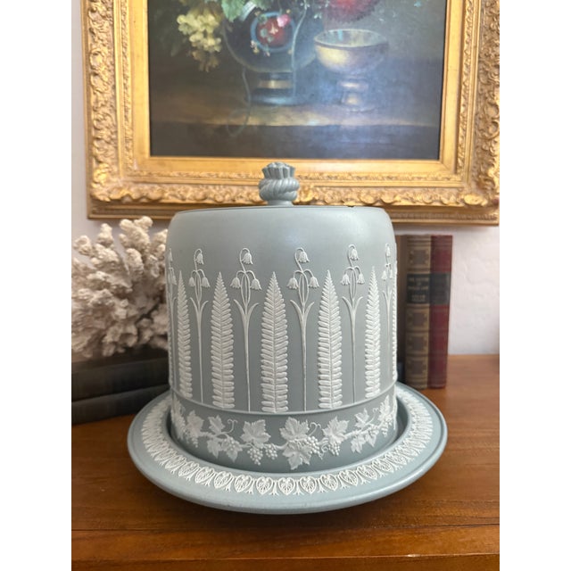An exceptionally charming antique James Dudson cheese dome and matching underplate in a sophisticated muted blue-green...