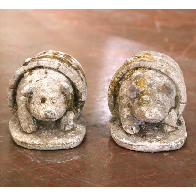 Whimsical and full of rustic character, this set of two antique French garden sculptures depicts cheerful pigs emerging...