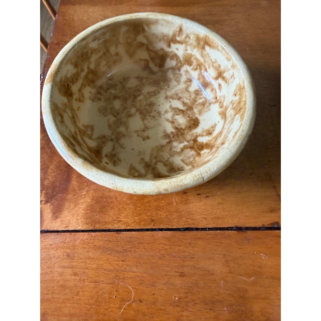 Assorted Bennington pieces including Crock with wooden lid minor chips under the rim of lid that aren't visible . Four...