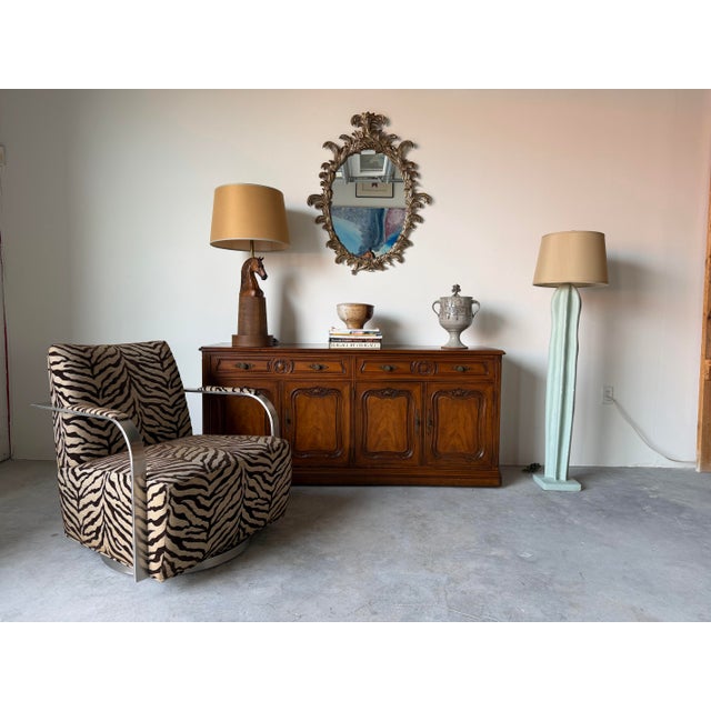 Elegant 1970s French Provincial sideboard cabinet by Henredon featuring beautifully carved walnut construction with rich...