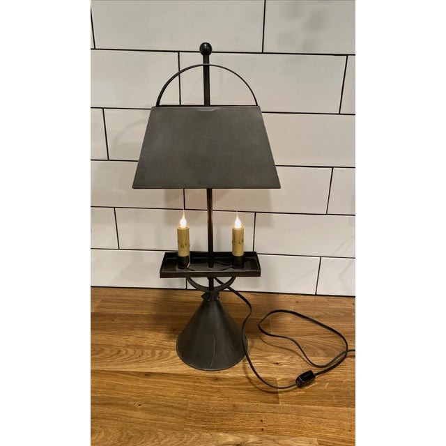 Approximately 21.5" tall - about 25" tall with shade at highest point. Shade is 10" wide 4" deep; base 5.5" diameter Shade...