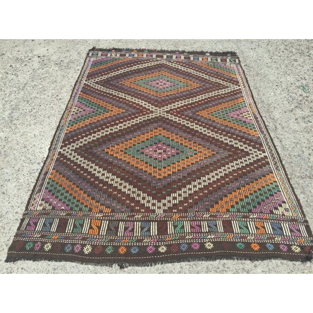 A beautiful vintage handwoven kilim. The kilim approximately 60 years old. It is handmade, of very fine quality in all...