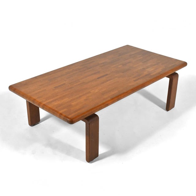 This extraordinary Scandinavian coffee table is crafted of solid teak. The understated form has a number of great details:...