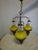 Complete chandelier from the 1970s, with an imposing brass frame, three frosted white glass shades shaped like oil lamps,...