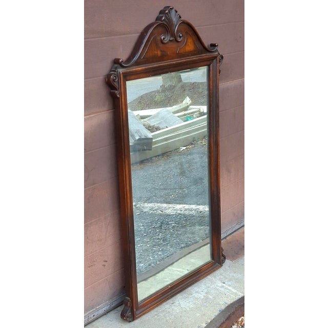 1920s Elite Furniture Comany Neoclassical revival wall mirror with Mahogany wood frame adorned with an Ornate carved...