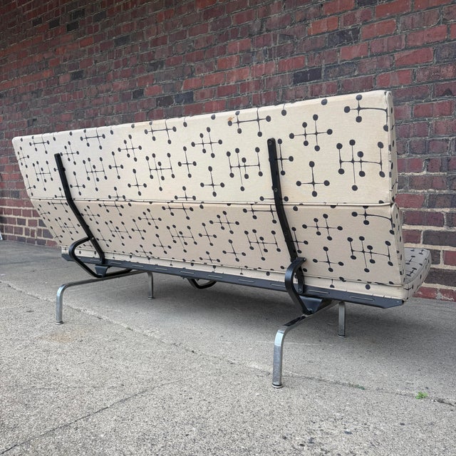 This is a Herman Miller by Eames Compact Sofa covered in Eames Small Dot fabric. Featuring chrome-steel legs, fabric...