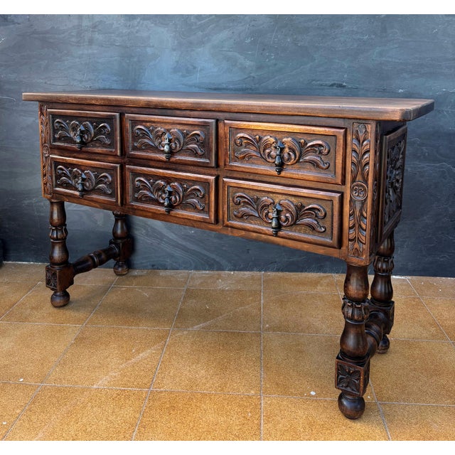 Impressive Spanish Renaissance Revival sideboard crafted in solid oak, dating from 1930. The piece features six drawers...